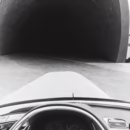 a car with its door open sitting in the parking lot
