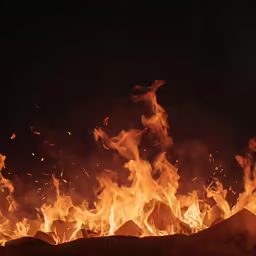 an open fire that has been lit at night
