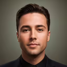 a man is posing for a picture wearing a black shirt and black tie