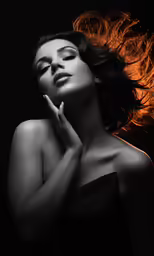 a woman with her hair in the wind