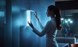 a woman standing in front of a blue light wall