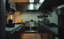 a kitchen with several stainless steel appliances and counter tops