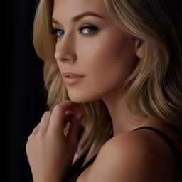 a woman with blonde hair is looking ahead