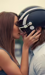 two women kiss each other as they are dressed in helmets