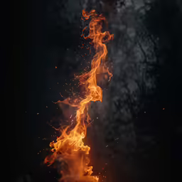 a bonfire is lit and blazing up in the dark