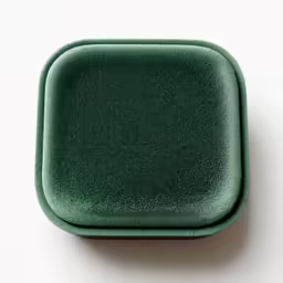 green square button on white surface for decoration