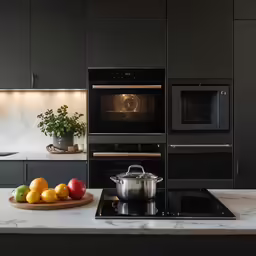 a modern kitchen with an open oven and multiple appliances