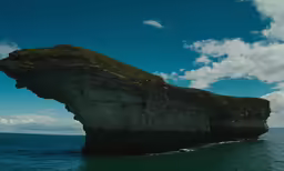 the rock formations are green and tall