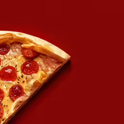 a small personal size pizza sitting on top of a red surface