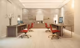 a white and wood office space features multiple desks