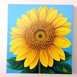 a painting of a large sunflower on a blue background,a yellow flower is on the wall of the room