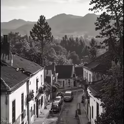 a road going through a small city with several houses