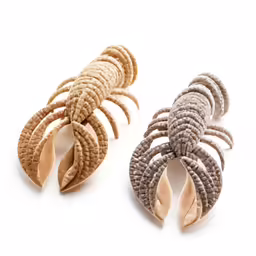 the braided hair clips are made of brown, gray and white yarn