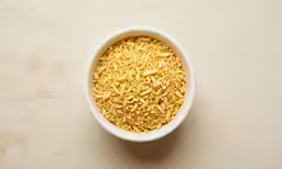 the cereal is prepared in a white bowl