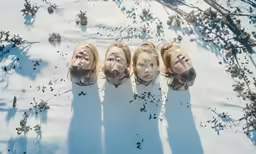 four female heads and heads have been painted red