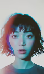 a woman with blue hair has bright colored light on her face