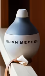 the large, round air freshener sits on the window sill
