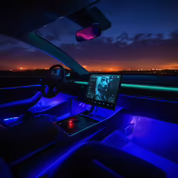 a night time car with a screen in the center