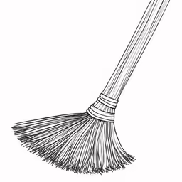 a broom sitting on top of a white surface