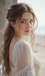 a girl with brown hair is in the middle of an outdoor portrait