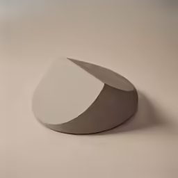 a white and gray object on top of a brown floor