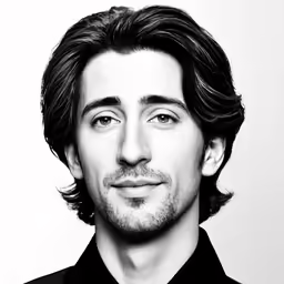 a close up photo of a person wearing a black shirt