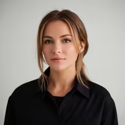 a female with blond hair is looking straight ahead