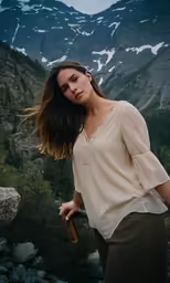 a woman in a white shirt posing for a photo