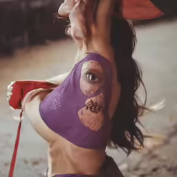 a woman with a shirt that has a cigarette in her mouth
