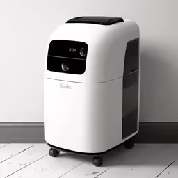 a white air cleaner sitting on top of a hard wood floor