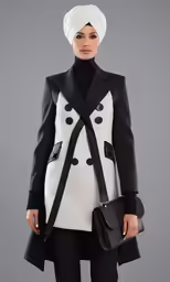 a woman is dressed in black and white