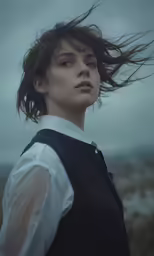 a woman with flying hair on top of her head