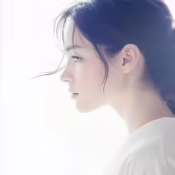 a close up of a person with long dark hair