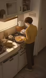 a woman wearing a yellow sweater in a kitchen cooking
