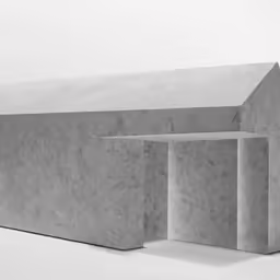 a white building with two boxes stacked up to the top