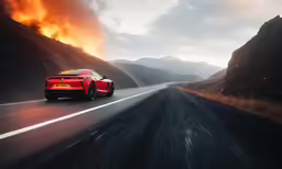 a red sports car traveling down a mountain road