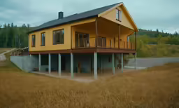 a house that is sitting on the side of a hill