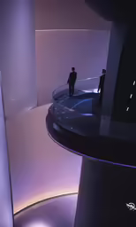 two people stand at the end of a circular walkway