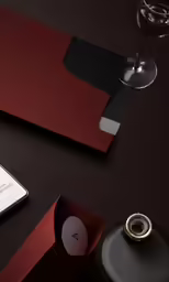 the cell phone has a silver ring next to it