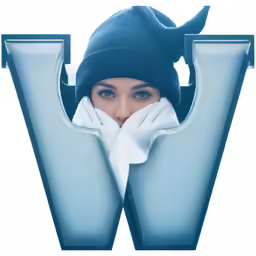 a woman in winter clothes behind a capital w