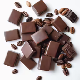 chocolate and nuts all laying on the table