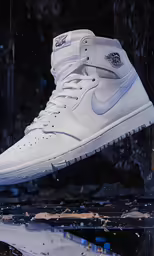 a pair of white sneakers on the ground