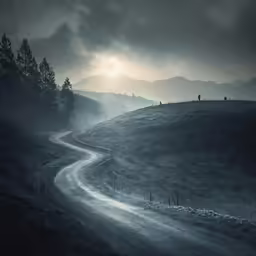 a country road winding through a countryside with sun coming through the cloudy clouds