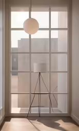 a room with lots of windows, and an illuminated light
