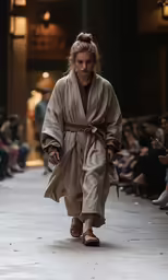 a model walking down the runway at a fashion show