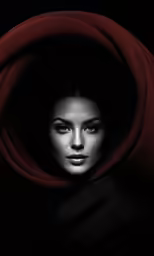 a woman with her face hidden by the fabric