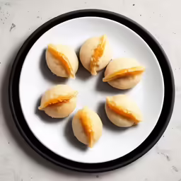 a plate of food with different types of pastry on it