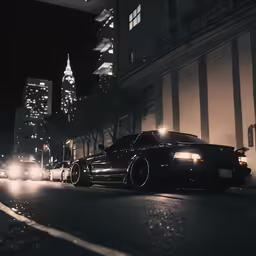 a couple of cars driving down a city street