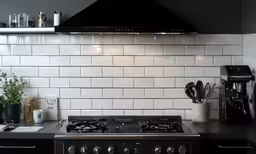 there is a stove top on the wall in the kitchen