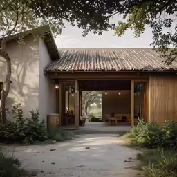 a house with a large covered porch that opens up onto a patio